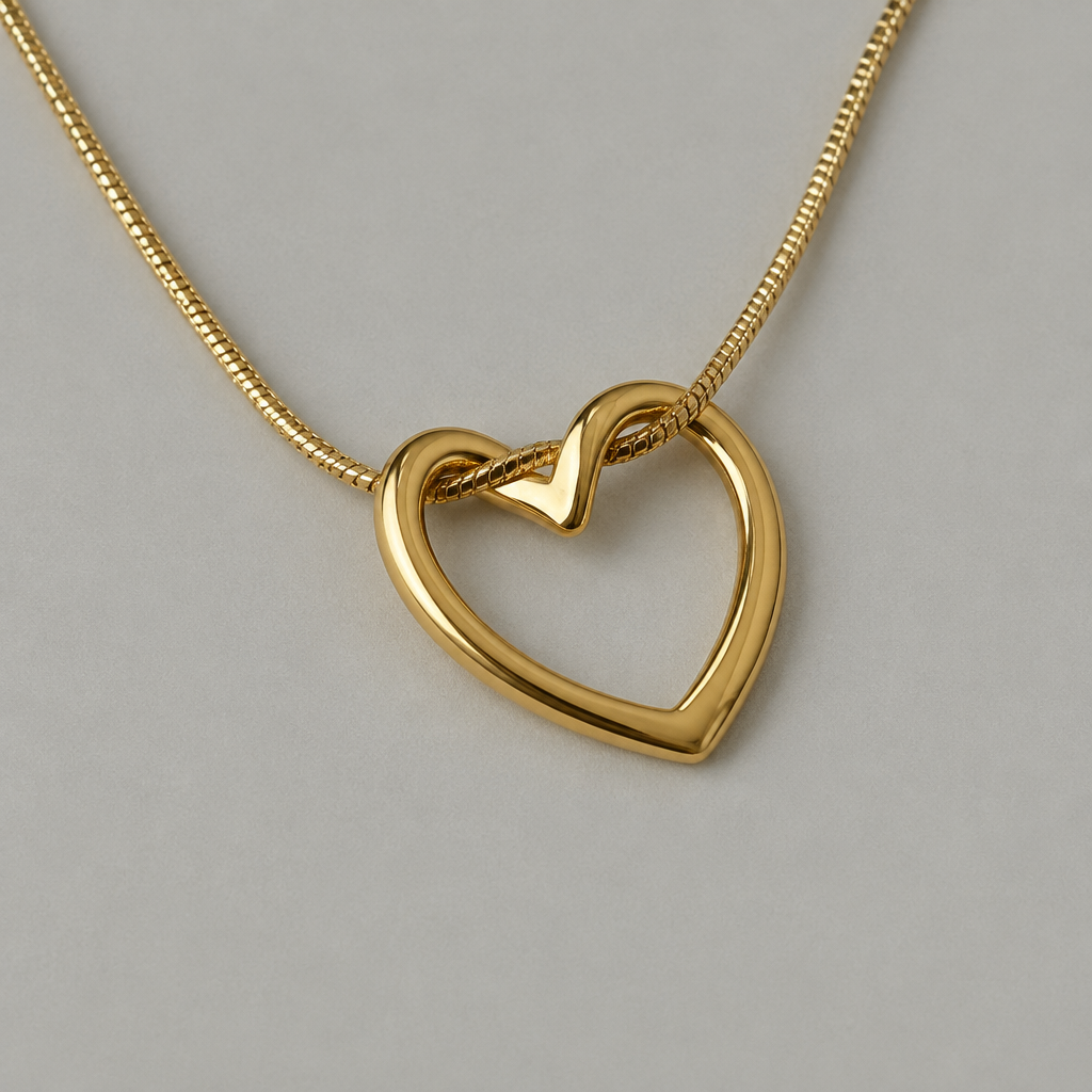 Close view of gold-tone open heart pendant and fine chain