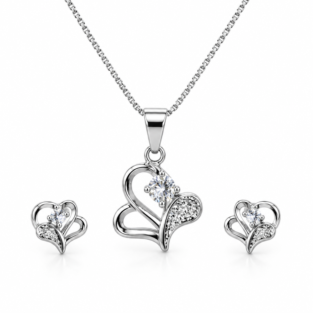 Silver-tone curved heart necklace and matching studs on white