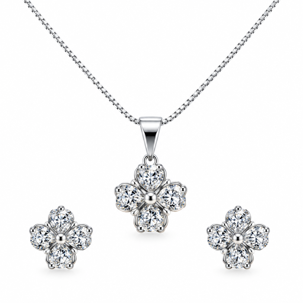 Silver-tone flower pendant necklace and matching stud earrings against white